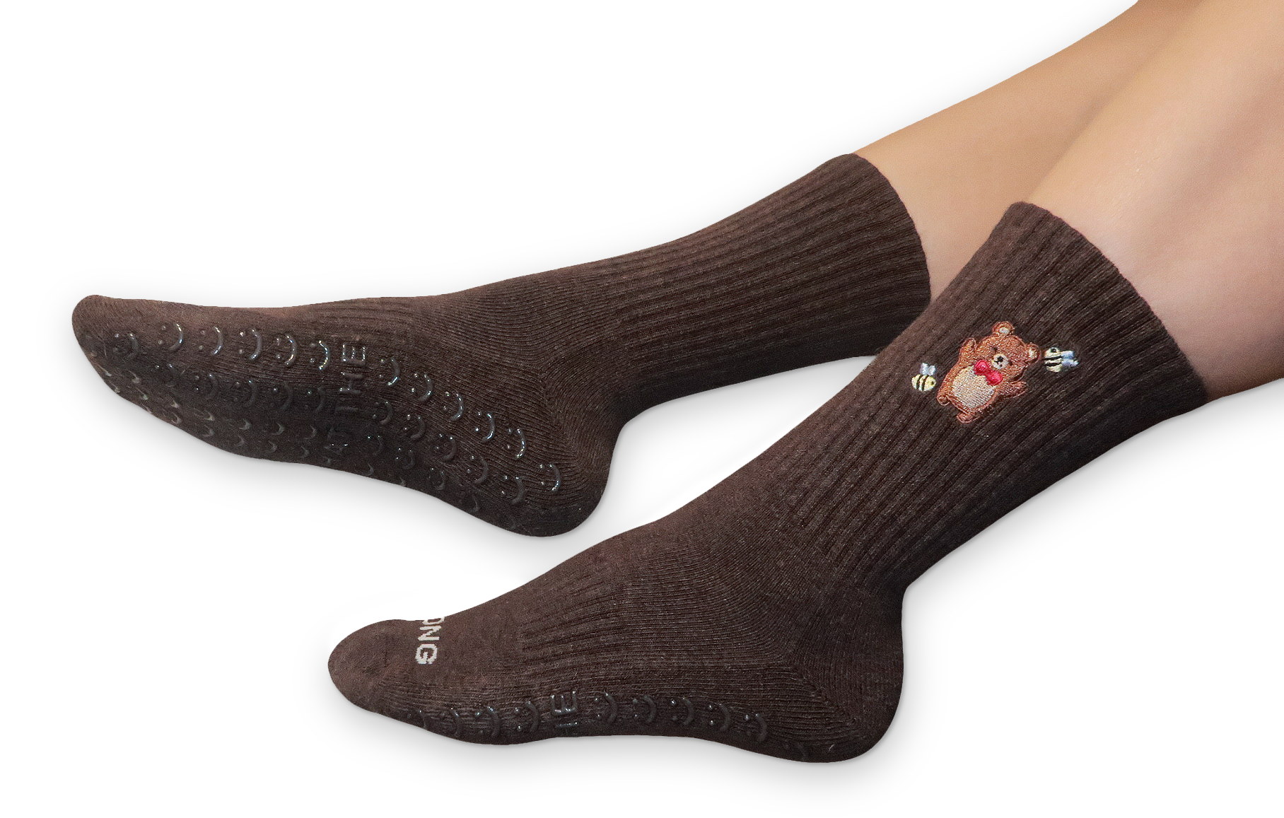 Legs wearing brown Beary Strong grip socks